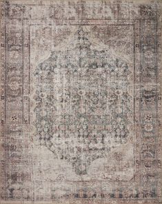 an antique rug with faded colors and ornate designs on the bottom, in neutral tones