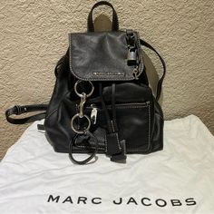 Marc Jacobs The Bold Grind Leather Backpack - Color: Black - Material: Grained Leather Exterior - Condition: Used - Fair Condition - Dimensionsl 10.5"W X 5.5"D X 12"H; 4" Handle Drop - One Exterior Zip Pocket, Three Interior Slip Pockets, And One Interior Zip Pocket - Dust Bag Included Feel Free To Comment/Message With Any Questions. Thanks! Marc Jacob Backpack, Leather Backpack Black, Bags Marc Jacobs, Black Leather Backpack, Jacob Black, Marc Jacobs Bag, Be Bold, Leather Backpack, Marc Jacobs