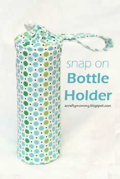 a blue and green polka dot bottle wrapper with the words snap on bottle holder