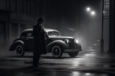 a man standing next to an old fashioned car in the street at night with fog