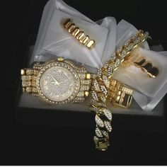 Bundle Deal - Men's Hip-Hop Bling Watch, Iced Out Bracelet & Gold Top/Bottom Grillz Bracelet Length - 9" Inches Stone Color - Clear Cubic Zirconia Metal Color - Gold Plated Watch Watch Case Diameter: 45mm Watch Case Thickness:10mm Display: Analog Dial Material Finish: 14k Gold Grillz Gold Grillz Top And Bottom With Free Silicone - Everything Is Brand New All Items Are New / Unused In Sealed Package. We Sell Only Top Quality Products And Never Cut Corners To Insure Your Safety And Quality. Gold Diamond Watch With Jubilee Bracelet As Gift, Gold Round Diamond Watch Gift, Gold Bracelets With Diamond Hour Markers For Gift, Gold Diamond Jewelry And Watches For Gift, Gold Diamond Jewelry And Watches As Gifts, Luxury Gold Jewelry With Diamond Hour Markers, Iced Out Bracelet, Bottom Grillz, Bling Watch