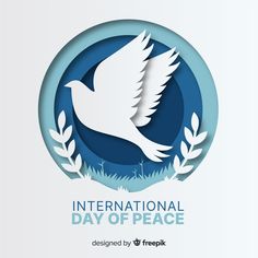 the international day of peace with a dove and laurels in paper cut out style