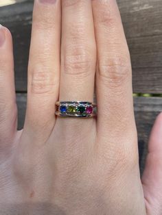 Total Weight: 3.8 grams Size: 7 Band Width: 3-6mm Sapphire: 3.75mm Emerald: 3.75mm Peridot: 3.75mm Spinel: 3.75mm Condition: In great condition showing little wear and no damage. All gold has been thoroughly checked with an Olympus RFK spectrometer. It is guaranteed 14k gold.  All our jewelry is properly washed and disinfected to ensure customers get clean items with every order.  Returns accepted but may be subjected to a restock fee.  Please message with any questions:) Heirloom Multicolor Jewelry With Accent Stones, Peridot Three Stone Ring, Three Stone Peridot Ring Jewelry, Emerald Cut Birthstone Gemstones For Anniversary, Three Stone Peridot Ring, Rainbow Multi-stone Birthstone Ring For Anniversary, Anniversary Multi-stone Rainbow Birthstone Ring, Anniversary Rainbow Multi-stone Birthstone Ring, Multi-stone Round Jewelry For May Birthstone