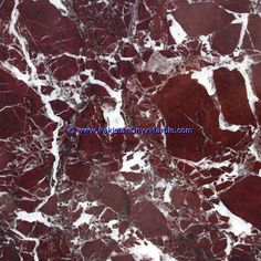 red marble with white veining on it