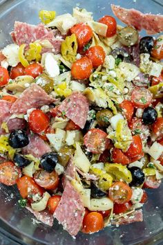 a glass bowl filled with lots of different types of food