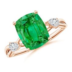 an emerald and diamond ring with two diamonds on the band, set in 18k rose gold