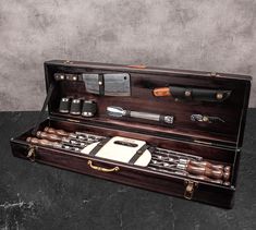 an old wooden tool box with tools in it