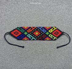 This beautiful beaded bracelet is hand-woven by the women of the Embera Chami Indigenous Tribe of Colombia Southwestern Multicolor Friendship Bracelets For Festivals, Southwestern Multicolor Festival Friendship Bracelets, Traditional Multicolor Woven Beaded Bracelets, Southwestern Style Multicolor Handwoven Beaded Bracelets, Fair Trade Beaded Bracelet For Festivals, Traditional Beaded Bracelets As Gift, Traditional Festival Braided Bracelets With Round Beads, Traditional Braided Bracelets With Round Beads For Festivals, Traditional Beaded Bracelet As Gift