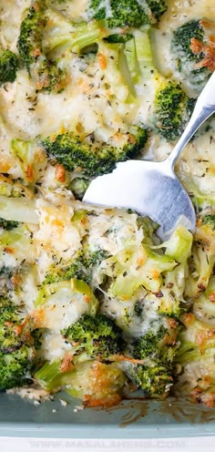 broccoli and cheese casserole with a spatula in the bottom dish