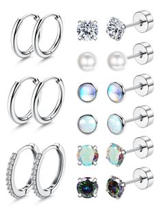 six pairs of piercings with different shapes and sizes, including an opal stone