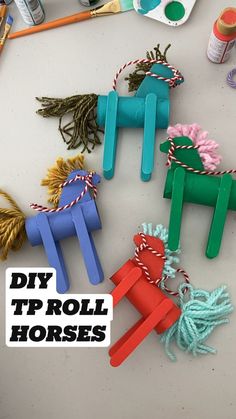 diy tp roll horses made out of popsicle sticks and twine yarn