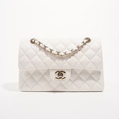 Brand: Chanel Style: Classic Flap Size: Small Width: 23.5 cm Height: 15 cm Depth: 7 cm Handle Drop: 24 - 44 cm Condition: As New Exterior Colour: White Interior Colour: White Hardware Colour: Gold﻿Leather Type: Caviar (Grained Calfskin) Serial Code: 30****** Manufactured In: France | 2020 Comes With:﻿ , Dustbag and Luxe Collective DustbagDelivery 5-8 or 10-15 working days Please note that during high season and Sale period, delivery times may be affected We accept payment with a Credit card, Deb Vintage Chanel Bag, White Hardware, Dream Bag, Chanel Style, Future Wardrobe, Interior Colour, Bag Collection, Chanel Jewelry, Chanel Fashion