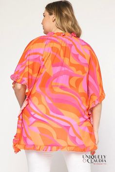 Our EDGY PLUS: Kati Ruffles Tunic is the perfect piece to take your look from basic to effortless chic! Our flowy poncho style top features an artful print in shades of orange and pink, giving you that girly but powerful look. With a self tie at the front neckline and ruffle sleeves, you'll attract attention everywhere you go! The lightweight woven fabric with a ruffle hem will keep you comfortable all day and night - no matter what your plans are. Make a statement with our EDGY PLUS: Kati Ruffl Trendy Abstract Print Blouse For Beach, Trendy Beach Blouse With Abstract Print, Trendy Pink Top With Abstract Print, Trendy Pink Blouse With Abstract Print, Orange Ruffled Tops For Vacation, Oversized Pink Top For Beach, Orange Ruffled Top For The Beach, Orange Ruffled Top For Beach, Oversized Orange Top For Day Out