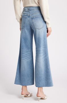 Made from superstretchy denim, these '70s-inspired palazzo jeans are remade for today with chewed hems and a slightly shorter inseam. 28 1/2" inseam; 28" leg opening; 11" front rise; 15" back rise (size 29) 77% cotton, 18% modal, 4% elasterell-p, 1% elastane Machine wash, tumble dry Made in Turkey Denim Blue Flares With Five Pockets For Spring, Fall Wide Leg Flares With Frayed Hem, Fall Wide-leg Flares With Frayed Hem, Spring Medium Wash Wide Leg Flares, Chic Spring Flares With Five Pockets, Chic Medium Wash Wide Leg Flares, Spring Flares With Five Pockets In Full Length, Spring Full-length Flares With Five Pockets, Spring Full Length Flares With Five Pockets