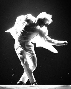 black and white photograph of a man on a skateboard