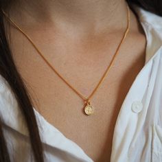 "Everyday fashion necklace, delicate super tiny coin pendant on dainty gold plated chain. Simple, minimalist and great on any outfit. Pendant size: 7.7mm Length: Choose from - 14\" to 18\" with optional extension of 1\"-2\" Please see VARIATIONS Model is wearing 17\" length. ♥ Back to my shop: https://etsy.me/2RQXbkO ♥ Ready to Ship ♥ FREE SHIPPING Estimated shipping time: 8- 20 business days ♥ How will I get it?  Your item will arrive in a beautiful, labeled box packaging. If you are purchasing Dainty Coin Necklace With Delicate Chain For Everyday, Dainty Everyday Necklace With Coin Pendant, Minimalist Everyday Charm Necklace With Coin Pendant, Dainty Coin Pendant Necklace For Everyday, Everyday Minimalist Charm Necklace With Coin Pendant, Delicate Everyday Coin Necklace, Dainty Medallion Charm Necklaces, Minimalist Yellow Gold Coin Necklace For Everyday, Minimalist Charm Necklace With Coin And Initial Pendants