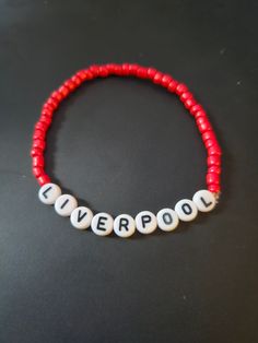 Liverpool Beeded Bracelet. Themed Avaliable in multiple colors, size. Novelty Letter Beads Wristband Bracelet, Personalized Red Novelty Bracelets, Customized Red Wristband For Friendship, Red Novelty Beaded Bracelets For Friendship, Customized Adjustable Red Wristband, Customized Red Casual Jewelry, Customized Casual Red Jewelry, Casual Customized Red Jewelry, Casual Red Customized Jewelry