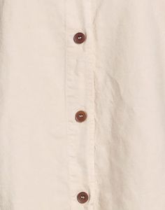 Elevate your wardrobe with the timeless sophistication of our Linen Shirt. Crafted in Italy with a blend of 51% linen and 49% cotton, this shirt is the epitome of quality and design creativity. Its long sleeves and button closing add a touch of versatility, while the solid color and classic neckline exude a sense of understated elegance. Perfect for both casual and formal occasions, this shirt seamlessly transitions from day to night with ease. The breathable fabric ensures all-day comfort, making it an ideal choice for those warm summer days or tropical getaways. Its classic silhouette offers a flattering fit for any body type, and the premium materials ensure long-lasting durability. Whether you're strolling along the beach or attending a business meeting, the Linen Shirt is a versatile Cream Collared Shirt For Fall, Winter Shirt With Button Closure And Spread Collar, Winter Shirt With Spread Collar And Button Closure, Fall Blouse With Fold Down Collar And Buttons, Cotton Long Sleeve Blouse With Covered Buttons, Solid Color Shirt With Button Closure And Spread Collar, Solid Shirt With Spread Collar And Button Closure, Solid Winter Shirt With Buttons, Winter Cotton Blouse With Button Closure