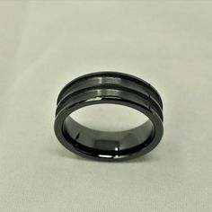 Black Ceramic Double Channel Ring Blank 8mm Wide 2.5mm Channels Product Information: Material: CeramicColor: BlackWidth: 8mmChannel: 2.5mm Double ChannelStyle: One Piece DesignComfort Fit: YesSizing: US 7-13.5 Benefit Of Using Our Blanks/Cores? Our ring blanks are polished on the inside of the ring this gives the ring a finished and perfected look. It also makes the ring more comfortable when wearing and taking on and off your finger. Our ring cores are brushed within the channel of the ring. Th Channel Ring, Lavender Opal, Ring Blanks, Lava Stone Bracelet, Ceramic Ring, Custom Wedding Rings, Black Fire, Opal Earrings Stud, How To Make Rings