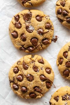 chocolate chip cookies on top of white paper