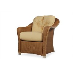 a brown wicker chair with beige cushions and a tan cushion on the armrests