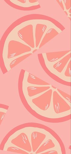 an orange slice is shown on a pink background