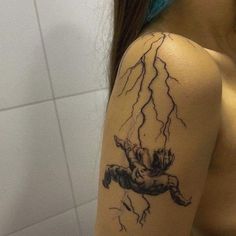 a woman with a tattoo on her arm