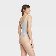 Update your separates closet with the Cotton Stretch Tank Bodysuit from Auden™. The tank bodysuit is made from soft and stretchy fabric to give you a comfortable fit that moves with you, and it boasts opaque lining for confident wear. With just the right touch of on-trend style, you can sport the pullover bodysuit with everything from jeans to shorts to skirts, and it's a great layering piece. Auden™: Fit for you in every way. Stretch Bodysuit With Moderate Back Coverage, Lined Scoop Neck Bodysuit For Loungewear, Stretch Scoop Neck Bodysuit For Loungewear, High Stretch Sleeveless Bodysuit For Loungewear, Stretch Cotton Bodysuit With Lined Body, Fitted Sleeveless Bodysuit, Lined Loungewear Bodysuit In Solid Color, High Stretch Lined Bodysuit For Loungewear, Stretch Bodysuit With Lined Body For Loungewear