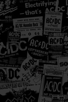 black and white concert flyers are piled up on top of each other, with the words ac dc printed across them