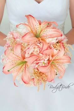 a bride holding a bouquet of flowers in her hands