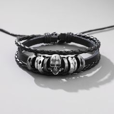 Material: Alloy Color: Black Fashion Element: Skull Style: Simple Adjustable Black Grunge Bracelet, Adjustable Black Grunge Bracelets, Black Metal Gothic Wristband, Halloween Skull Bracelets With Skull Print, Adjustable Black Leather Grunge Bracelet, Black Punk Jewelry With Skull Print, Black Punk Bracelet For Halloween, Black Metal Bracelets For Halloween, Black Metal Bracelet For Halloween