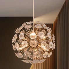 a chandelier hanging from the ceiling in a room