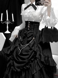 For a noble lady with gorgeous and dignified elegance. The contrast between her black and white makes her presence stand out. An elegant, voluminous skirt and an overskirt with even more volume and a high-waisted silhouette. Paired with a white blouse richly decorated with lace embroidery, her outfit is mysterious, yet dramatic and dazzling.       Item     Skirt   Overskirt   Blouse (white/red)         Size     Skirt     S size     Total length: 94cm   Waist: 70cm     M size     Total length: 94 Elegant Skirts, Voluminous Skirt, Elegant Skirt, Blouse White, Lace Embroidery