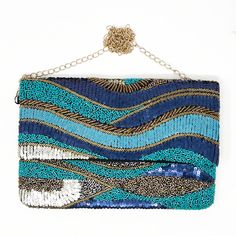 There's no chance you'll experience the blues when you're carrying this clutch. It reminds us of the waves of the ocean and no one has the blues staring at the beach 😎 12 in x 8 in Blue & Gold bead & sequin embellishments Black canvas backing and lining Rectangular Blue Beaded Clutch, Blue Beaded Clutch Evening Bag, Blue Beaded Clutch Bag, Blue Beaded Party Bag, Blue Rectangular Summer Clutch, Embellished Blue Party Clutch, Blue Embellished Party Clutch, Blue Embellished Rectangular Clutch, Blue Beaded Evening Bag For Party