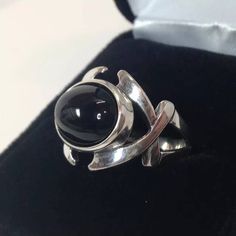 Gorgeous Black Onyx & Sterling Silver Split Shank Ring This piece features a comfortable split shank, with a bold, layered criss-cross design. * Cabochon Cut Genuine Black Onyx Oval measures 14mm x 10mm * Comfort Fit Band * Solid Sterling Silver * Size 7 (size 8 also available, please allow 3-5 days handling time for this size) Hallmarked & Gift Ready! Matching Cuff Bracelet Available here- https://www.etsy.com/listing/291464103/genuine-black-onyx-sterling-silver-ring?ref=shop_home_listi Black Metal Punk Rings, Black Punk Metal Rings, Punk Style Black Metal Rings, Black Sterling Silver Punk Rings, Adjustable Black Punk Style Rings, Punk Style Adjustable Black Ring, Black Gothic Round Jewelry, Gothic Black Round Jewelry, Split Shank Ring