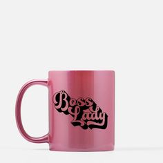 a pink coffee mug with the words boss lady printed on it's front and side