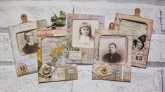 several old fashioned photographs are hanging on a white brick wall with tags attached to them