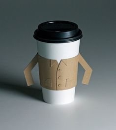 a coffee cup with a cardboard character on it