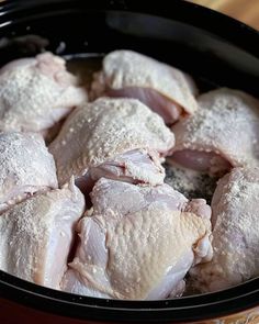 raw chicken in a slow cooker ready to be cooked