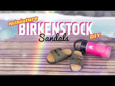 an advertisement for birkenstock sandals on a wooden table next to a water bottle