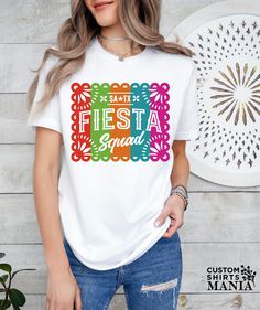 a woman wearing a t - shirt that says fiesta squad