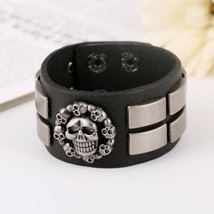 Do you love the gothic outfit? you should read our blog on the topic. this gothic leather skull is designed for dark outfits and dark minds! get yours without waiting! Greetings ladies and gentlemen, are you looking for a simple, sober, stealthy new bracelet to add to your collection, if so then this gothic skull bracelet will be ideal for you, with its great design and simplicity it will go very well with most of your outfits especially since it is colored in black and silver and we know that b Silver Skull Leather Bracelet In Punk Style, Punk Silver Leather Skull Bracelet, Silver Skull Punk Leather Bracelet, Black Gothic Leather Bracelet With Skull Shape, Black Gothic Leather Bracelet With Skull, Gothic Black Leather Bracelet With Skull, Black Gothic Leather Skull Bracelet, Gothic Black Leather Skull Bracelet, Black Punk Leather Bracelet