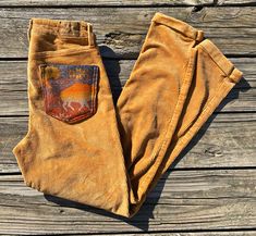 "American Eagle brand corduroy pants size 00.  Authentic Pendleton™️ wool used for the pockets. Inseam 28\" Waist 13\" Hips 16 1/2\" Rise 12\"" Fall Corduroy Pants With Patch Pockets, Fall Corduroy Pants With Hip Pockets, Vintage Pants With Patch Pockets For Fall, Fall Corduroy Pants With Side Pockets, Corduroy Pants With Side Pockets For Fall, Corduroy Straight Leg Pants With Hip Pockets, Straight Leg Corduroy Pants With Hip Pockets, Straight-leg Corduroy Pants With Hip Pockets, Fitted Corduroy Pants With Pockets