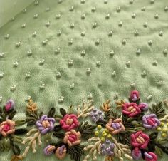 an embroidered fabric with flowers on it