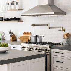 a kitchen with an oven, stove and counter top