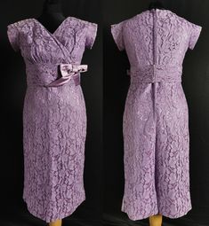 A smart vintage fashion cocktail dress dating to the 1950s. One piece, an under dress in a very silk like synthetic, over layed with purple floral machine lace. Fitted, with a long centre back dyed to match ' Opti ' zip, the bodice with cross over pleats, v neck and short, part grown on sleeves. Below the knee straight skirt with layered vent in the back. Wide waistband in the silk like fabric, with large bow and hook fastening. CONDITION Very good. Some slight fading which hasn't really shown i Lavender Lace Evening Dress, Fitted Purple Lace Dress, Elegant Purple Lace Wedding Dress, Lavender Fitted Formal Dress, Formal Fitted Purple Mother Of The Bride Dress, Purple Fitted Formal Mother Of The Bride Dress, 1950s Fitted Lace Dress, Vintage Lavender Dress For Evening, Vintage Lavender Evening Dress