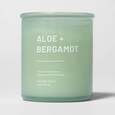 an aloe + bergamot candle on a white background