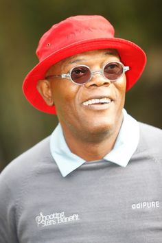 a man wearing a red hat and sunglasses