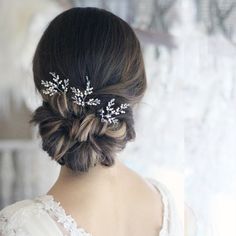 the back of a woman's head wearing a bridal hair comb