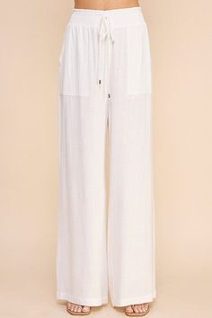 Stay comfortable and stylish in our Linen Wide Leg Pants! Made from soft linen, these pants feature a smock waist and wide leg design for a laid-back yet chic look. With convenient pockets, these pants are both practical and fashionable. Perfect for any casual occasion. Linen Wide Leg Pants, Wide Leg Linen Pants, Midi Cocktail Dress, Chic Look, Leg Design, Romper Dress, Short Jumpsuit, Trouser Jeans, Dress Accessories